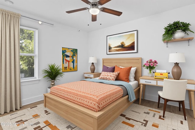 4220 Ribault River Ln, Jacksonville, FL 32209 - bedroom with baseboards, a ceiling fan, wood finished floors, and visible vents