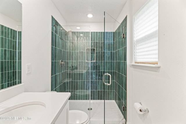 80 Boulder Ln, Saint Johns, FL 32259 - bathroom with vanity, toilet, a stall shower, and recessed lighting