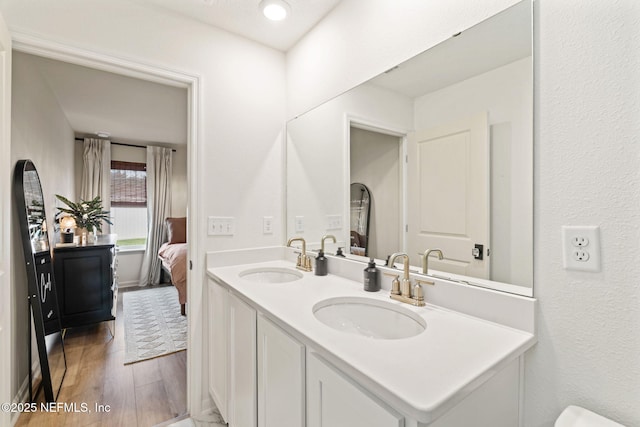 80 Boulder Ln, Saint Johns, FL 32259 - ensuite bathroom with double vanity and wood finished floors