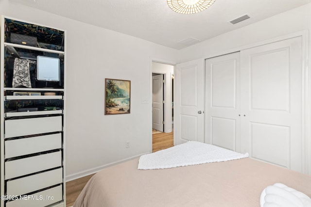 80 Boulder Ln, Saint Johns, FL 32259 - bedroom featuring wood finished floors, a closet, and baseboards