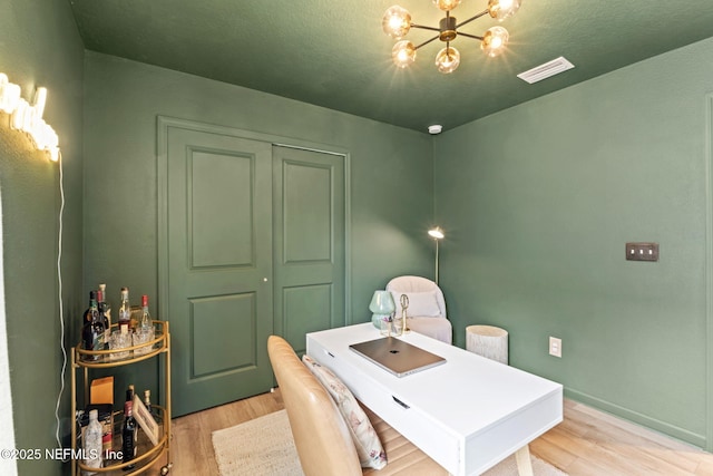 80 Boulder Ln, Saint Johns, FL 32259 - office featuring wood finished floors, a chandelier, and baseboards