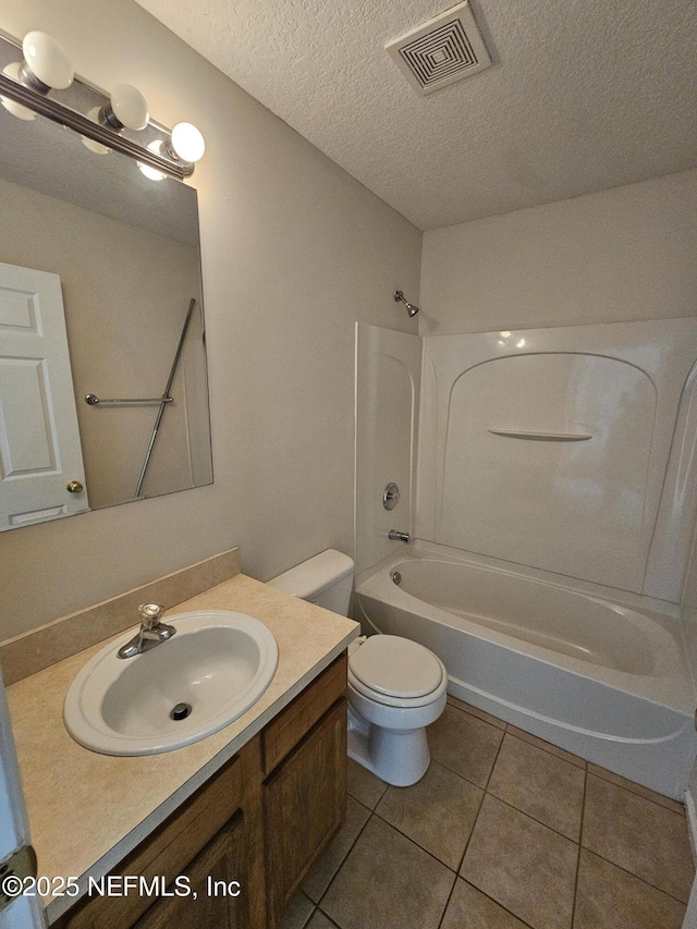 full bath featuring visible vents, tile patterned flooring, vanity, toilet, and bathtub / shower combination
