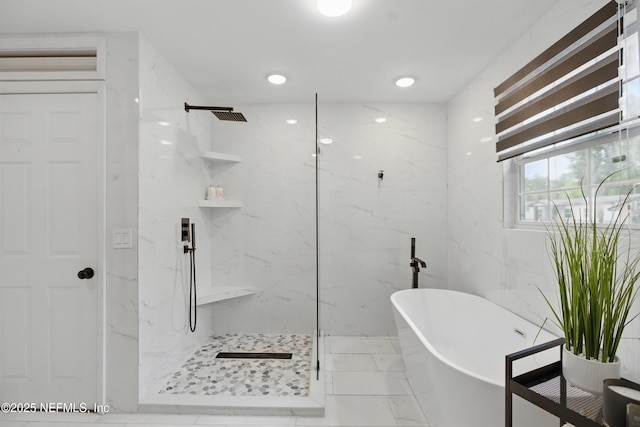 6878 Lenox Ave, Jacksonville, FL 32205 - bathroom featuring marble finish floor, a freestanding tub, and a marble finish shower
