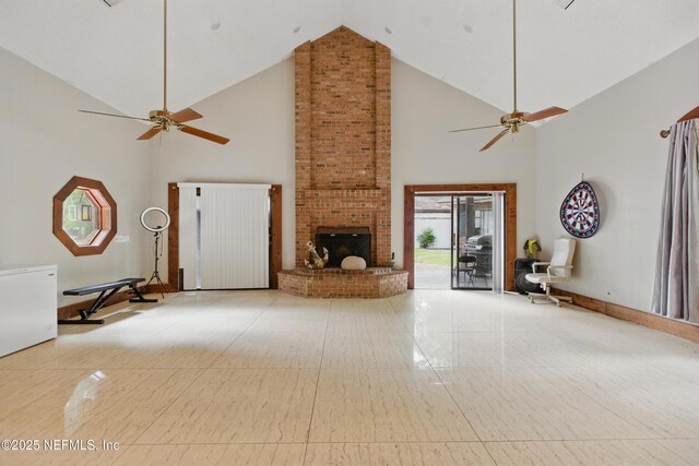 6878 Lenox Ave, Jacksonville, FL 32205 - unfurnished living room featuring high vaulted ceiling, a fireplace, and a ceiling fan