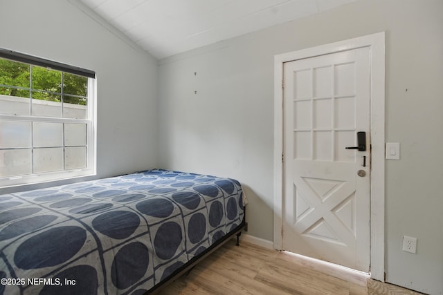 6878 Lenox Ave, Jacksonville, FL 32205 - bedroom with light wood-style floors and lofted ceiling