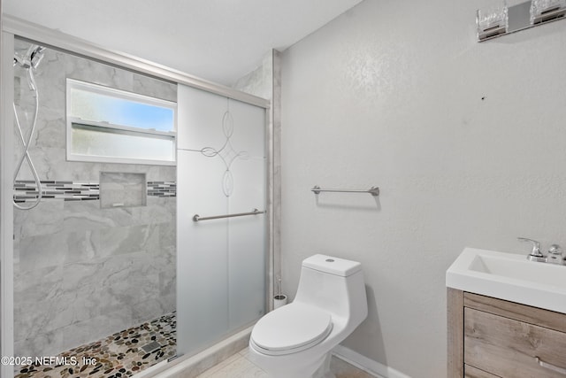 6878 Lenox Ave, Jacksonville, FL 32205 - bathroom with vanity, baseboards, a tile shower, and toilet