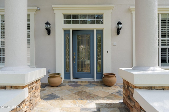 2762 Seagate Ave, Jacksonville Beach, FL 32250 - view of exterior entry with covered porch and stucco siding