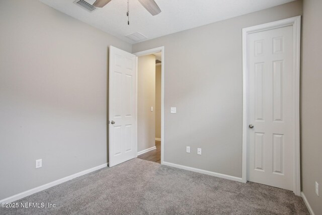 300 Downs Corner Rd, Saint Augustine, FL 32092 - unfurnished bedroom with baseboards, ceiling fan, carpet, and visible vents