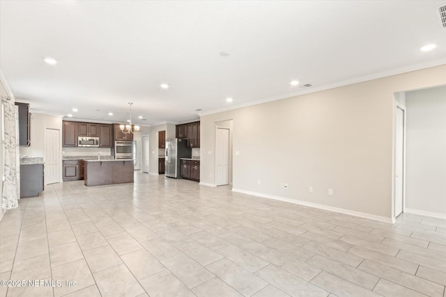 unfurnished living room with crown molding and recessed lighting