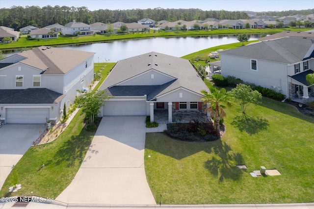 aerial view featuring a water view and a residential view
