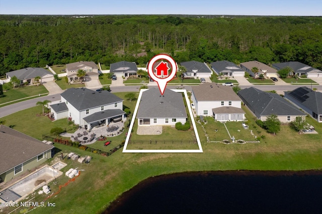 bird's eye view featuring a view of trees and a residential view