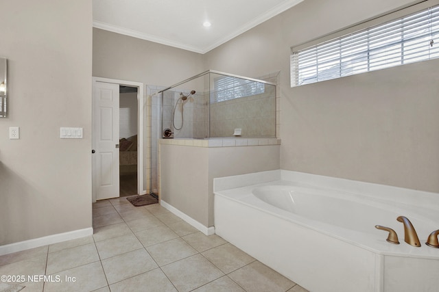 bathroom featuring a garden tub, ornamental molding, baseboards, tile patterned floors, and a tile shower