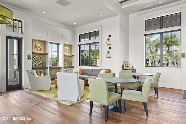 dining area with recessed lighting, visible vents, and hardwood / wood-style flooring