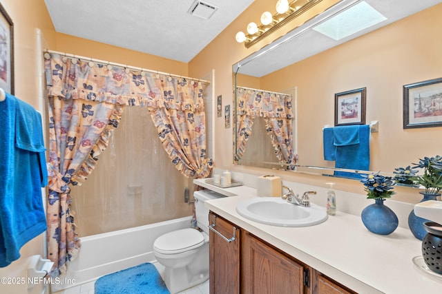 full bath with visible vents, tile patterned flooring, vanity, toilet, and shower / bath combo