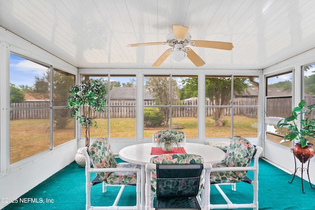 sunroom featuring ceiling fan and a wealth of natural light