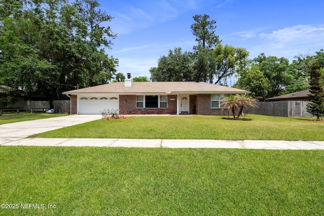 ranch-style house with fence, an attached garage, a front lawn, brick siding, and concrete driveway