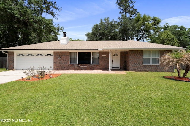 ranch-style home featuring driveway, a chimney, a garage, brick siding, and a front lawn