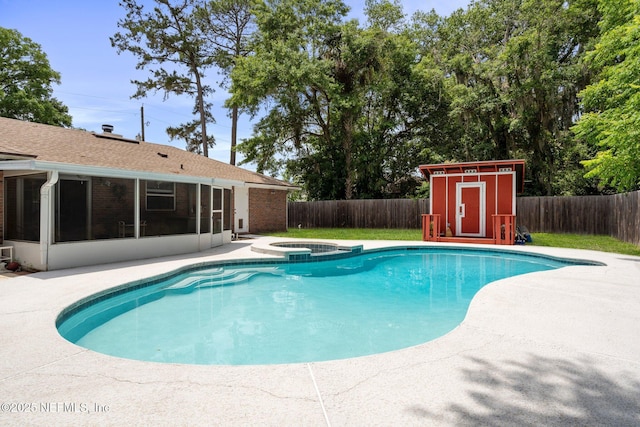 view of pool with a fenced backyard, a sunroom, and a patio area