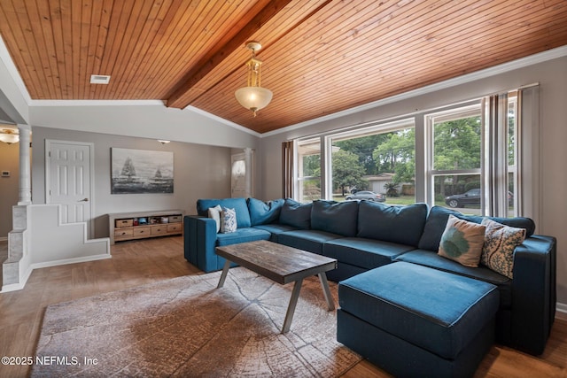 living room featuring wood ceiling, baseboards, ornamental molding, and wood finished floors