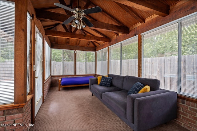 sunroom / solarium with beamed ceiling, a ceiling fan, and an outdoor living space