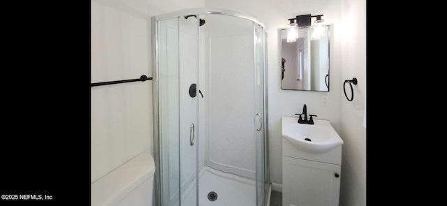 bathroom with vanity and a stall shower
