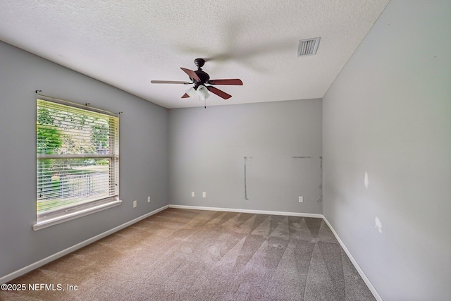 unfurnished room with baseboards, carpet flooring, a textured ceiling, and ceiling fan
