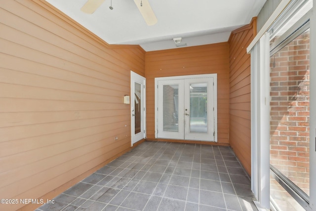 unfurnished sunroom with french doors