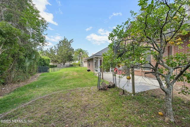 view of yard featuring a patio area and fence