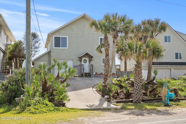 3365 N Ocean Shore Blvd, Flagler Beach, FL 32136 - view of front of home with an attached garage and concrete driveway