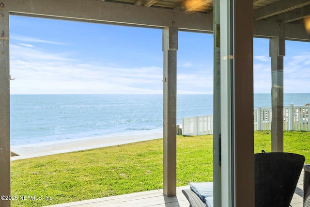 3365 N Ocean Shore Blvd, Flagler Beach, FL 32136 - doorway featuring a beach view, a water view, and a wealth of natural light
