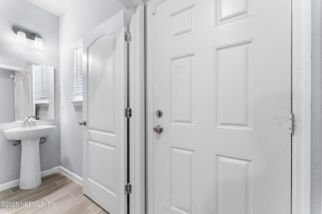 10318 Benson Lake Dr, Jacksonville, FL 32222 - bathroom with wood finished floors and baseboards