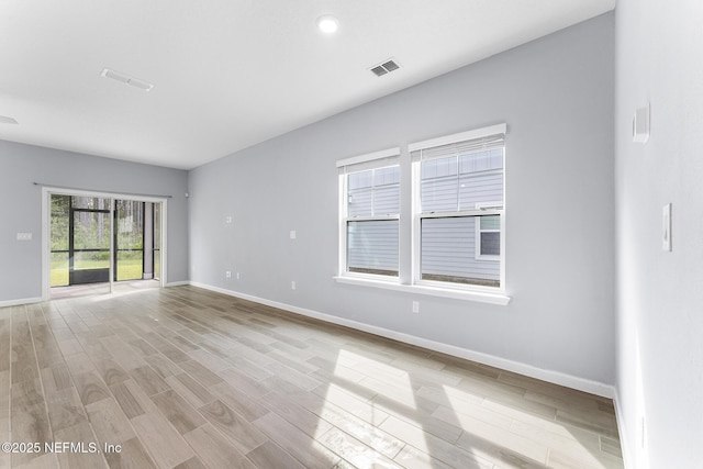 10318 Benson Lake Dr, Jacksonville, FL 32222 - empty room with baseboards and light wood-style flooring
