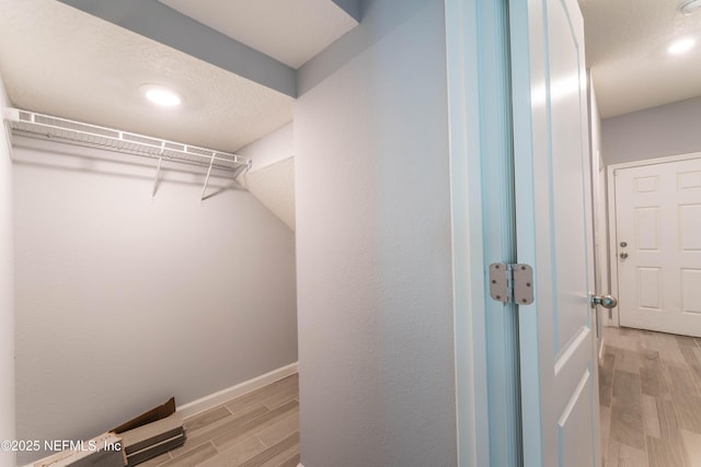 10318 Benson Lake Dr, Jacksonville, FL 32222 - walk in closet with light wood-type flooring