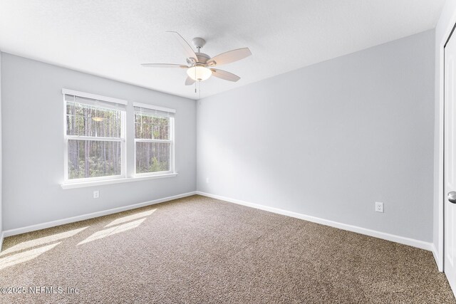 10318 Benson Lake Dr, Jacksonville, FL 32222 - unfurnished room with carpet floors, a ceiling fan, and baseboards