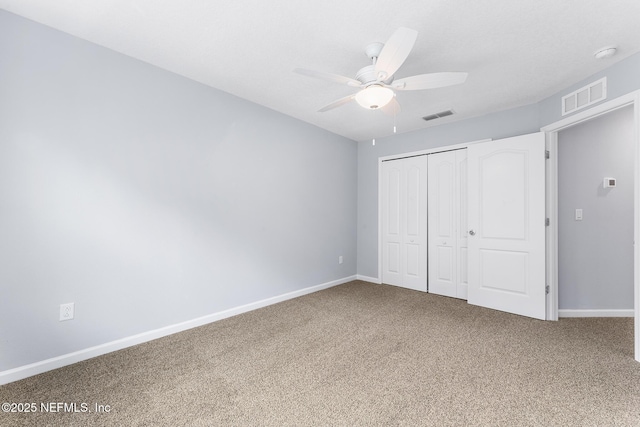 10318 Benson Lake Dr, Jacksonville, FL 32222 - unfurnished bedroom featuring carpet, baseboards, a closet, and ceiling fan