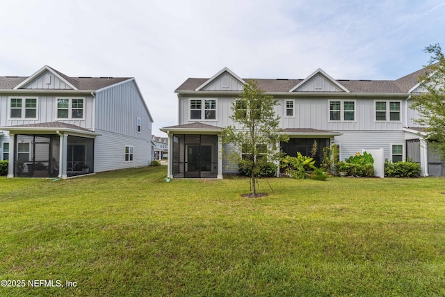 10318 Benson Lake Dr, Jacksonville, FL 32222 - rear view of property featuring a sunroom, board and batten siding, and a lawn