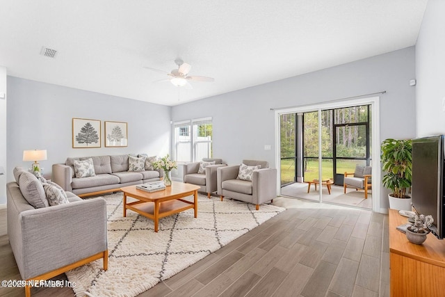 10318 Benson Lake Dr, Jacksonville, FL 32222 - living room featuring ceiling fan and wood finished floors