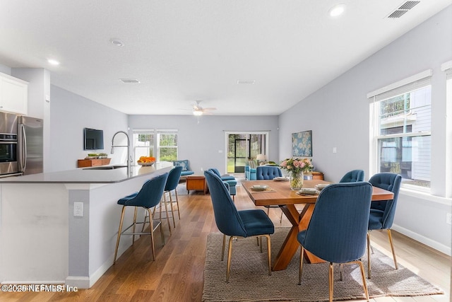10318 Benson Lake Dr, Jacksonville, FL 32222 - dining space with light wood finished floors, baseboards, recessed lighting, and a ceiling fan