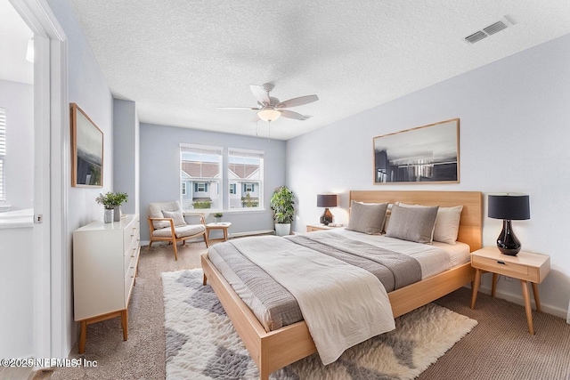 10318 Benson Lake Dr, Jacksonville, FL 32222 - carpeted bedroom featuring baseboards, a textured ceiling, and a ceiling fan