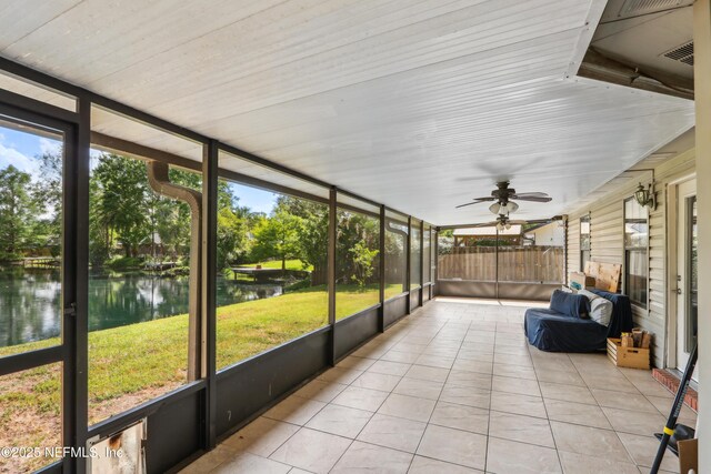 400 Harvest Bend Dr, Fleming Island, FL 32003 - unfurnished sunroom featuring a water view and ceiling fan