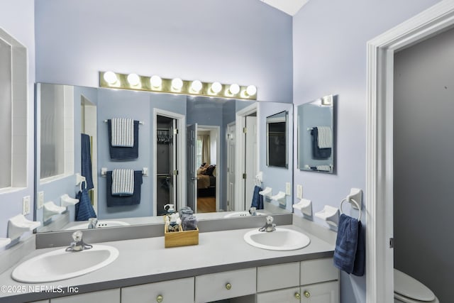 400 Harvest Bend Dr, Fleming Island, FL 32003 - bathroom featuring connected bathroom, double vanity, and toilet
