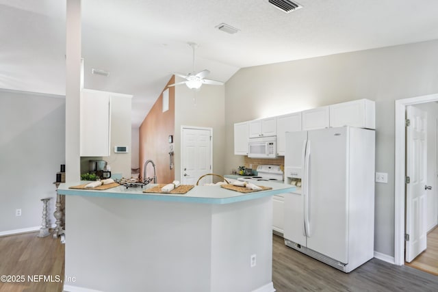 400 Harvest Bend Dr, Fleming Island, FL 32003 - kitchen with white appliances, wood finished floors, white cabinetry, ceiling fan, and light countertops