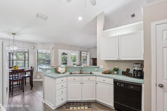 400 Harvest Bend Dr, Fleming Island, FL 32003 - kitchen featuring black dishwasher, a sink, a peninsula, white cabinets, and lofted ceiling