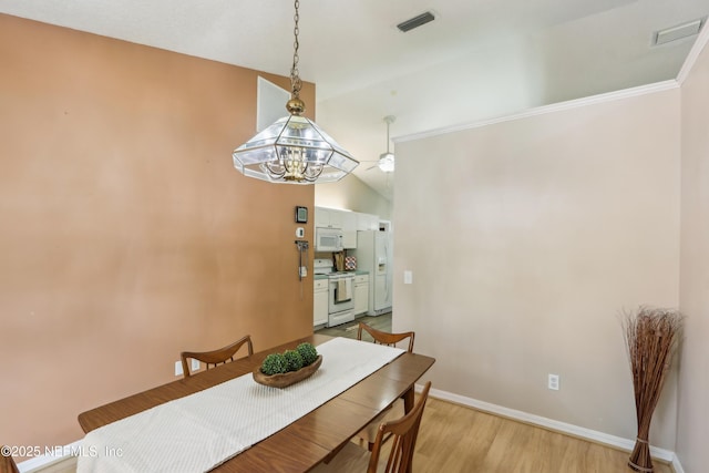 400 Harvest Bend Dr, Fleming Island, FL 32003 - dining room featuring a chandelier, baseboards, and light wood-style floors