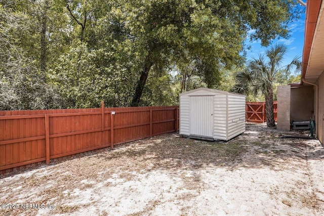 5088 Merrifield Ct, Spring Hill, FL 34608 - view of yard with a fenced backyard, an outbuilding, and a storage shed