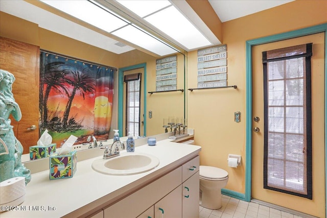 5088 Merrifield Ct, Spring Hill, FL 34608 - bathroom with vanity, tile patterned floors, and toilet