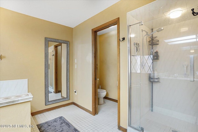 5088 Merrifield Ct, Spring Hill, FL 34608 - full bath featuring baseboards, tile patterned flooring, a stall shower, and toilet