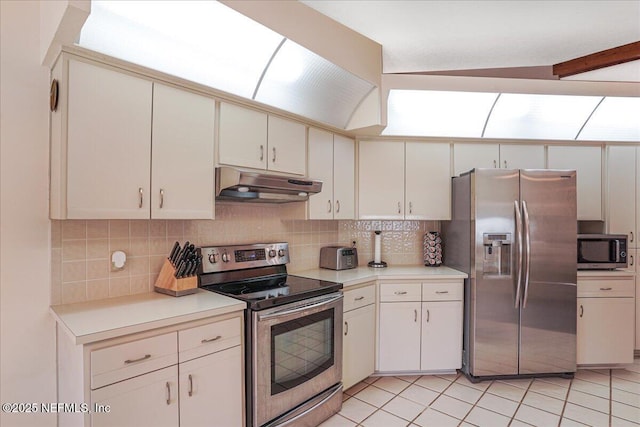 5088 Merrifield Ct, Spring Hill, FL 34608 - kitchen featuring light countertops, backsplash, under cabinet range hood, and stainless steel appliances