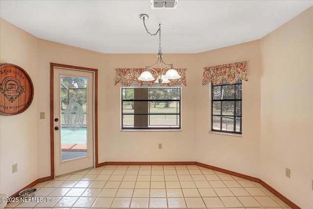 5088 Merrifield Ct, Spring Hill, FL 34608 - unfurnished dining area featuring baseboards, an inviting chandelier, light tile patterned floors, and visible vents
