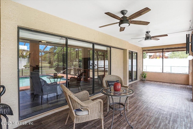 5088 Merrifield Ct, Spring Hill, FL 34608 - sunroom / solarium with a textured wall, a healthy amount of sunlight, and wood finished floors